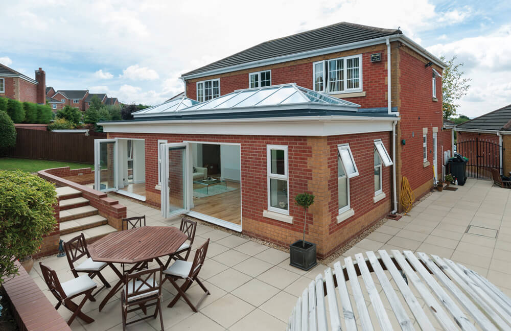 Large white uPVC orangery in Surrey.