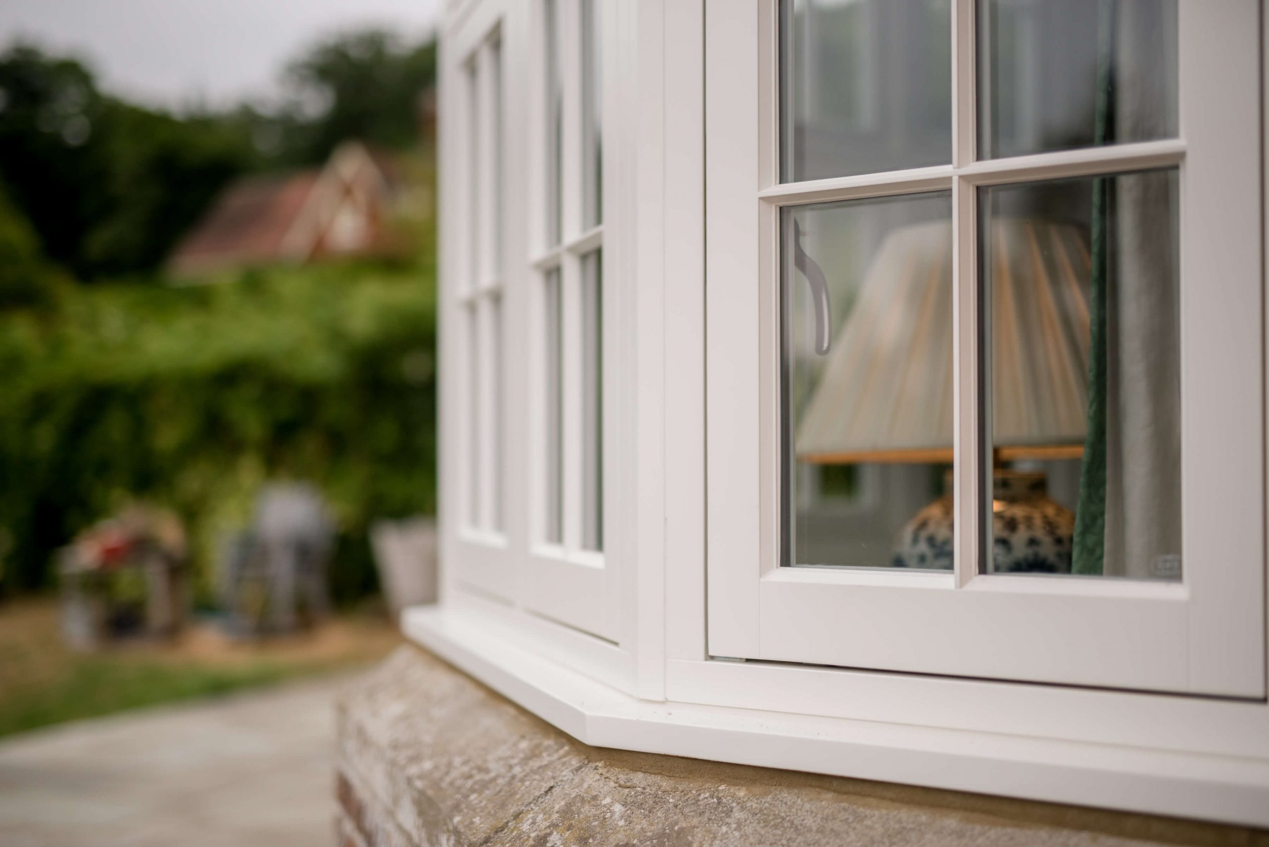 White timber bay window