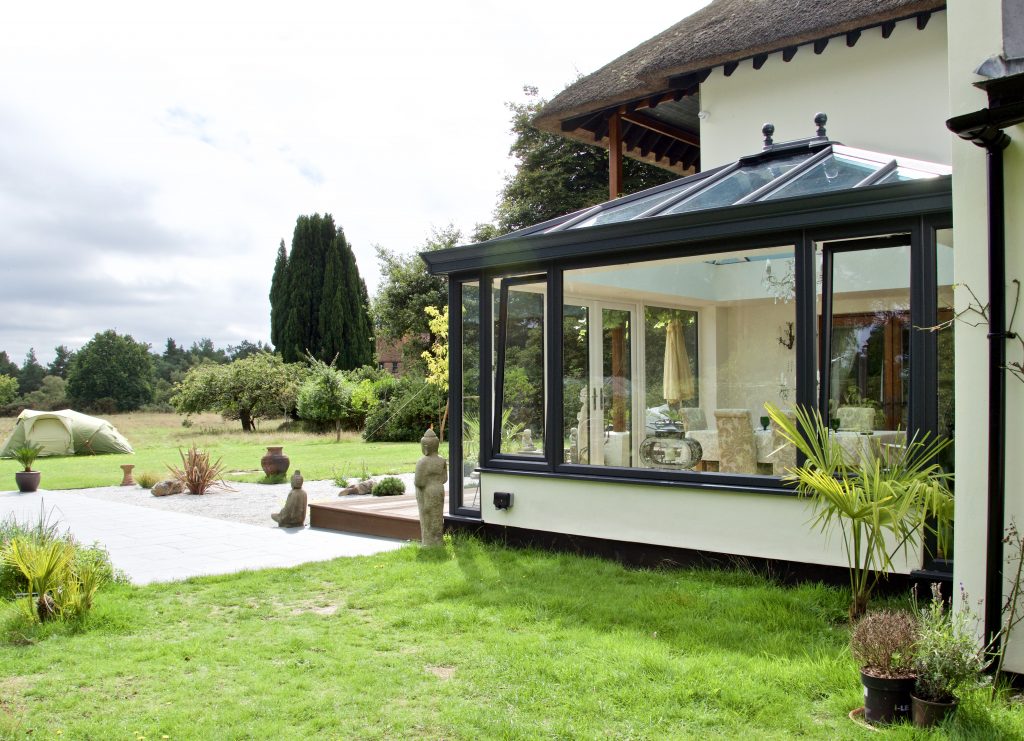 Black conservatory home improvement in a zen garden.