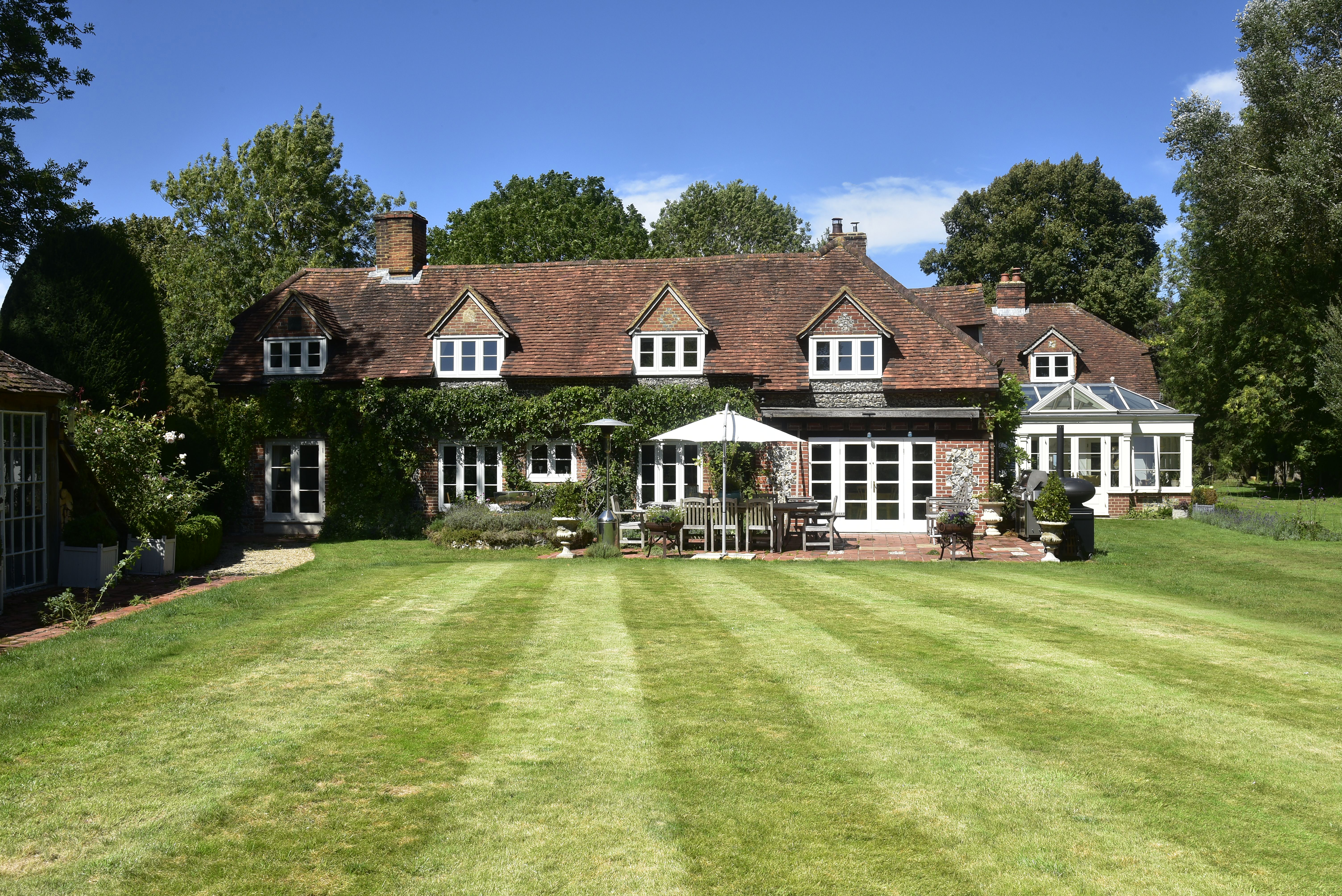 Outside a large cottage style house in Reading.