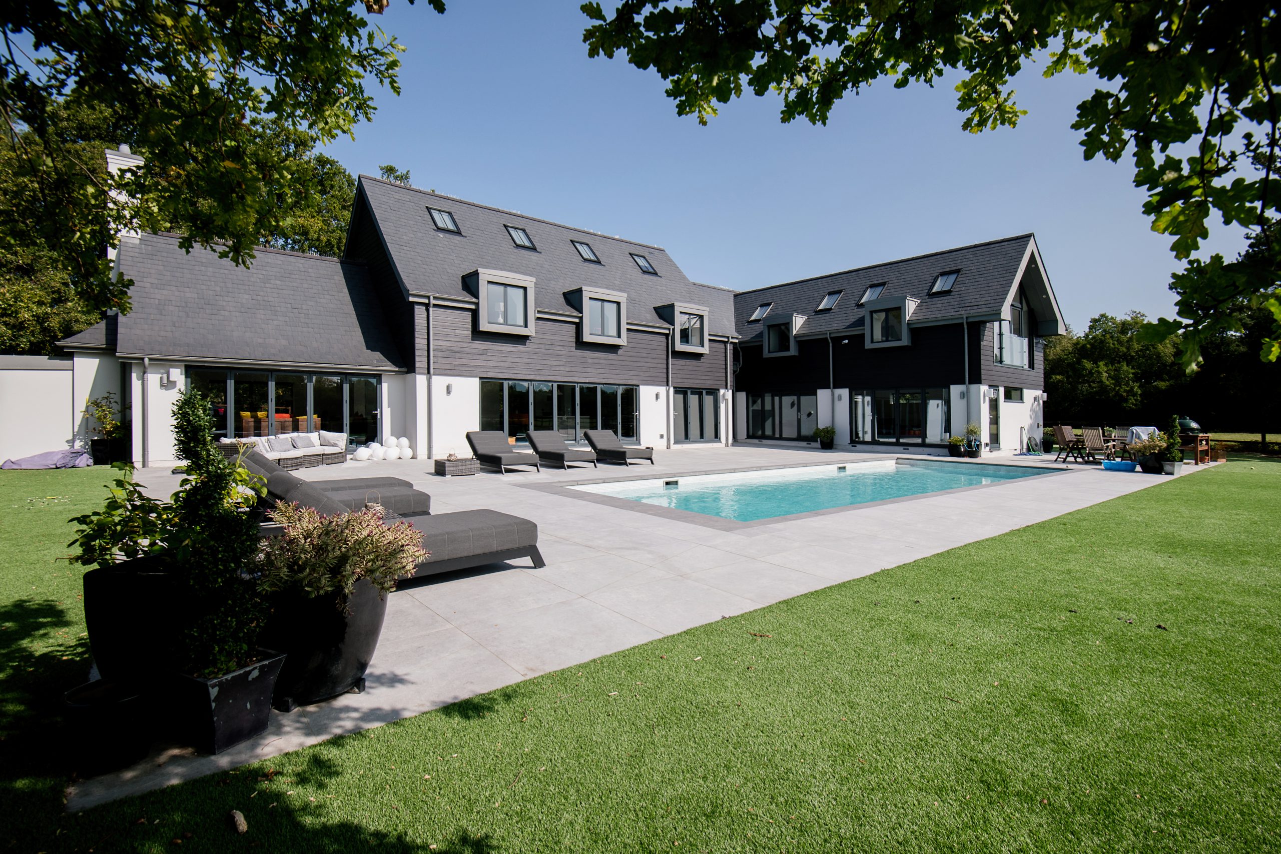 Outside a mansion in Eversley with swimming pool.