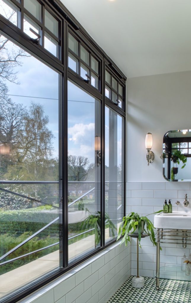 large black bifold window in bathroom