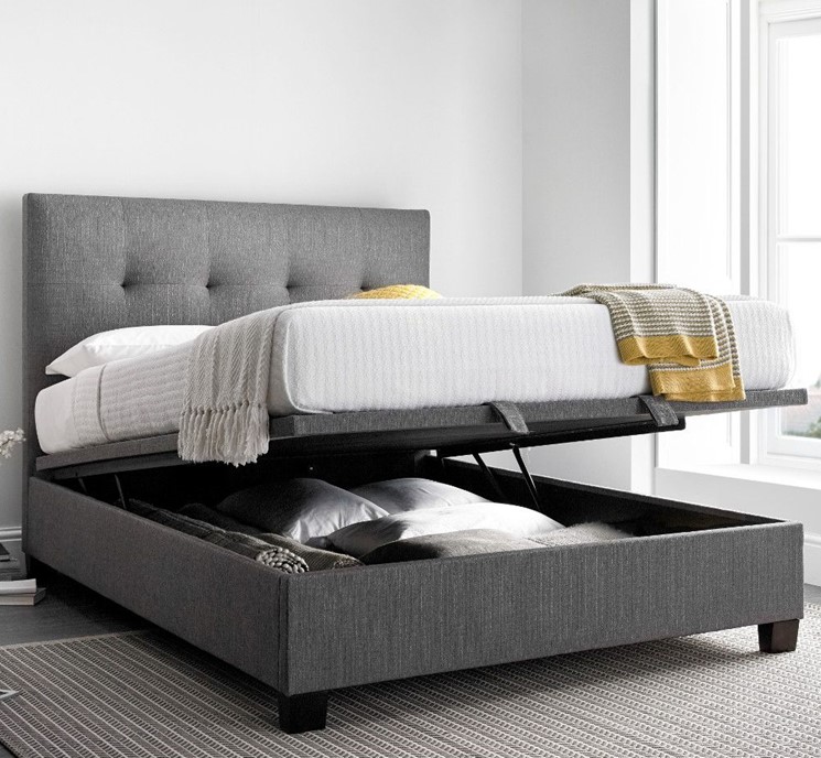 shot of an open grey ottoman bed